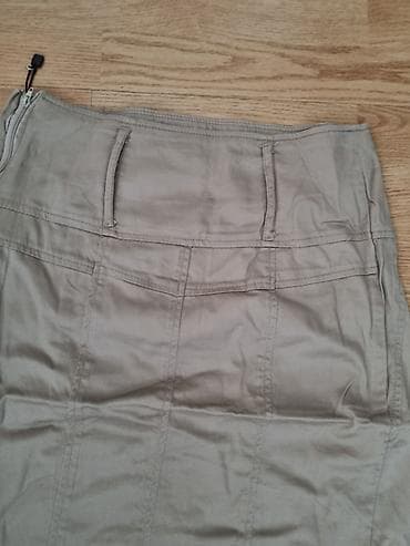 Suknja bež boje, dužine do kolena, sa visokim strukom i prorezom na at lalafo.rs Suknja bež boje, dužine do kolena, sa visokim strukom i prorezom na