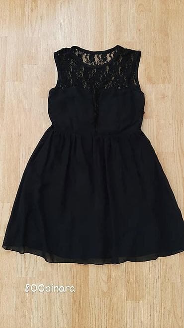 Elegantna ženska haljina bez rukava u crnoj boji, savršena za at lalafo.rs Elegantna ženska haljina bez rukava u crnoj boji, savršena za