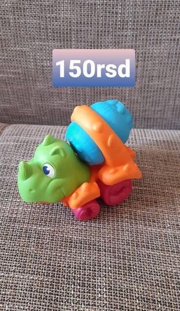 Muzički instrumenti za decu: Šarena dečja igračka – nosorog na točkićima sa rotirajućim bubnjem. - na lalafo.rs — 1 Muzički instrumenti za decu: Šarena dečja igračka – nosorog na točkićima sa rotirajućim bubnjem. - — 1