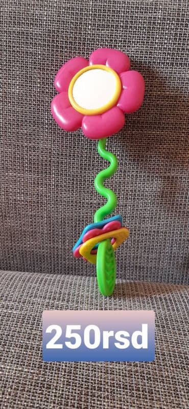 Plastična zvečka/grickalica u obliku cveta. - Šarena igračka sa na lalafo.rs Plastična zvečka/grickalica u obliku cveta. - Šarena igračka sa