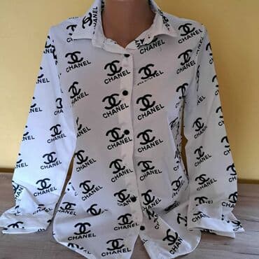 Na prodaju nove Chanel ženske košulje u beloj i crnoj boji. Dostupne na lalafo.rs Na prodaju nove Chanel ženske košulje u beloj i crnoj boji. Dostupne