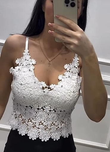 Beli čipkani crop top sa tankim bretelama - Materijal: delikatna na lalafo.rs Beli čipkani crop top sa tankim bretelama - Materijal: delikatna