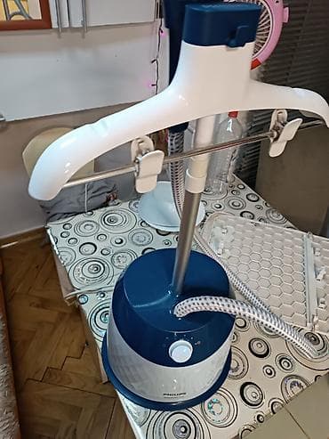 Vertikalne pegle na paru: Parni aparat za osvežavanje i peglanje odeće na stalku – Philips - na lalafo.rs — 1 Vertikalne pegle na paru: Parni aparat za osvežavanje i peglanje odeće na stalku – Philips - — 1