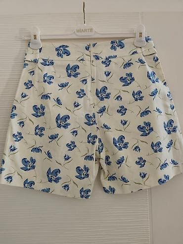Bele pamučne kratke pantalone sa plavim cvetnim dezenom marke Katrin na lalafo.rs — 2 Bele pamučne kratke pantalone sa plavim cvetnim dezenom marke Katrin — 2