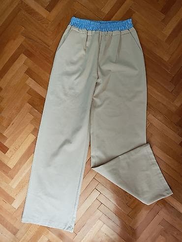 Bež široke pantalone sa elastičnim strukom - Model: ravne nogavice na lalafo.rs Bež široke pantalone sa elastičnim strukom - Model: ravne nogavice