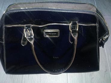 Elegantna crna ženska torba marke Pierre Cardin. Torba ima metalni na lalafo.rs — 1 Elegantna crna ženska torba marke Pierre Cardin. Torba ima metalni — 1