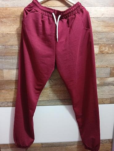 Unisex donji deo trenerke u bordo boji, idealan za sportske aktivnosti na lalafo.rs Unisex donji deo trenerke u bordo boji, idealan za sportske aktivnosti