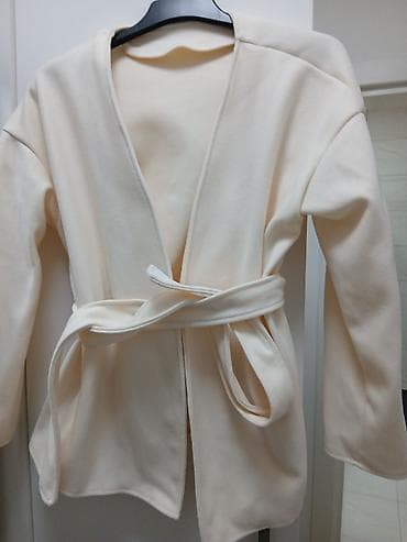 Ženski kardigan/kimono jaknica u bež (krem) boji. Otvorenog kroja bez na lalafo.rs Ženski kardigan/kimono jaknica u bež (krem) boji. Otvorenog kroja bez