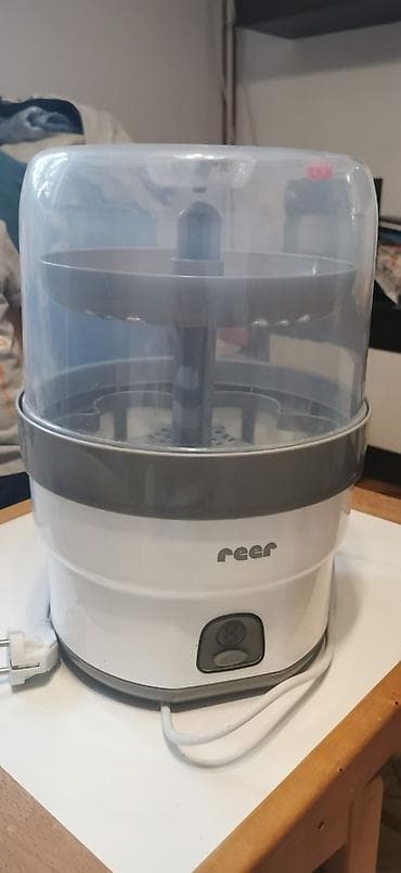 Reer sterilizator za 6 flašica, očuvan, kao nov - komotan i za na lalafo.rs Reer sterilizator za 6 flašica, očuvan, kao nov - komotan i za