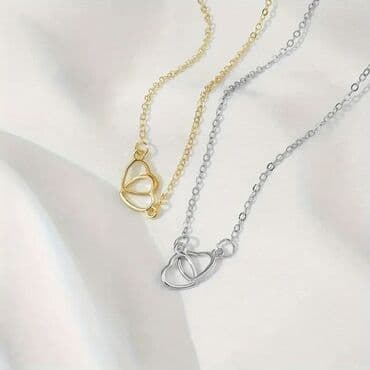 Ogrlica sa dva isprepletena srca - Dizajn: minimalistički privezak sa na lalafo.rs Ogrlica sa dva isprepletena srca - Dizajn: minimalistički privezak sa
