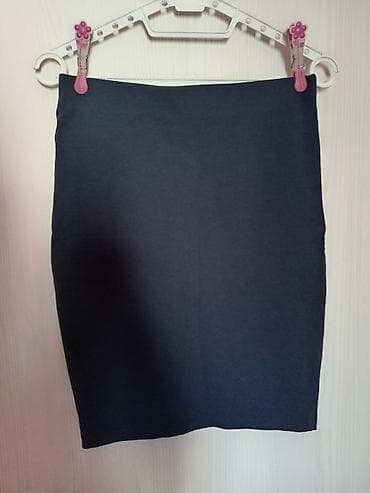 Nova pamučna teget suknja, uni veličina. Uska,dužina oko kolena. Koga na lalafo.rs Nova pamučna teget suknja, uni veličina. Uska,dužina oko kolena. Koga