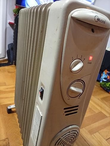 Uljani radijatori: Uljeni radijator Midea sa 12 rebara i ispravnim ventilatorom - Tip na lalafo.rs — 8 Uljani radijatori: Uljeni radijator Midea sa 12 rebara i ispravnim ventilatorom - Tip — 8