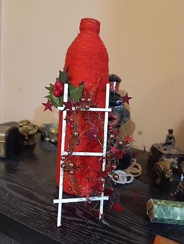 Ručno rađena novogodišnja dekoracija – bočica obmotana crvenim koncem na lalafo.rs — 3 Ručno rađena novogodišnja dekoracija – bočica obmotana crvenim koncem — 3