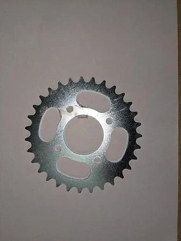 Zadnji lančanik za motocikl/skuter - Materijal: čelik, pocinkovan za at lalafo.rs Zadnji lančanik za motocikl/skuter - Materijal: čelik, pocinkovan za