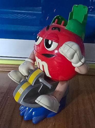 MM - M&M bonbone se ubace, i kad se povuce ruka ispadaju. Igracka na lalafo.rs — 5 MM - M&M bonbone se ubace, i kad se povuce ruka ispadaju. Igracka — 5