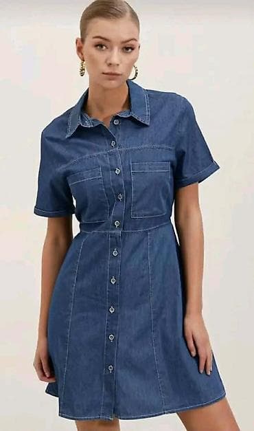 Džins košulja-haljina, mini dužine. - Materijal: denim (pamuk) na lalafo.rs Džins košulja-haljina, mini dužine. - Materijal: denim (pamuk)