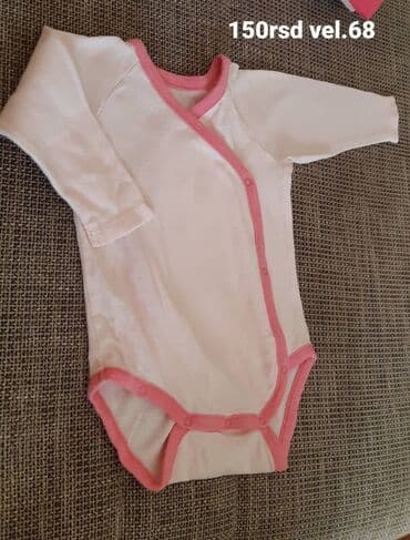 Bebi bodić na preklop, dug rukav. Belo sa roze obrubom. Kopčanje sa na lalafo.rs Bebi bodić na preklop, dug rukav. Belo sa roze obrubom. Kopčanje sa