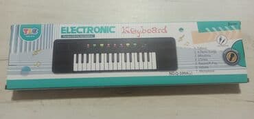 Muzički instrumenti za decu: Sintisajzer za decu sa mikrofonom - 32 dirke - 8 demo pesama - 8 na lalafo.rs — 2 Muzički instrumenti za decu: Sintisajzer za decu sa mikrofonom - 32 dirke - 8 demo pesama - 8 — 2