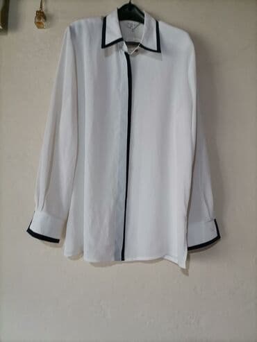 Elegantna bela ženska košulja sa crnim paspulima - Klasičan kroj sa na lalafo.rs Elegantna bela ženska košulja sa crnim paspulima - Klasičan kroj sa