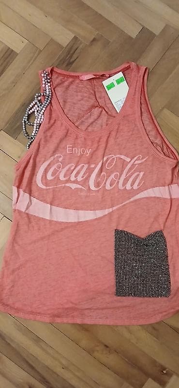 Ženska majica bez rukava „Enjoy Coca‑Cola” - Brend: Depandé (etiketa na lalafo.rs Ženska majica bez rukava „Enjoy Coca‑Cola” - Brend: Depandé (etiketa