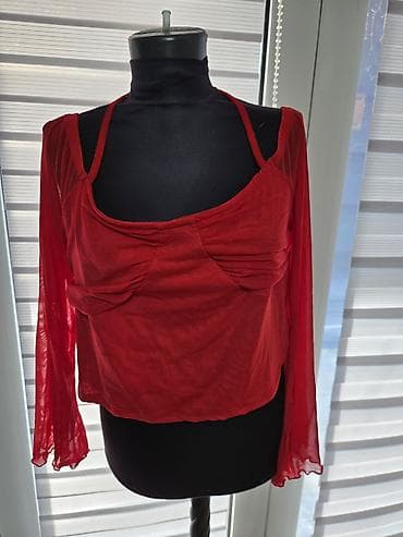 Crvena ženska bluza sa dugim, providnim rukavima i interesantnim na lalafo.rs Crvena ženska bluza sa dugim, providnim rukavima i interesantnim