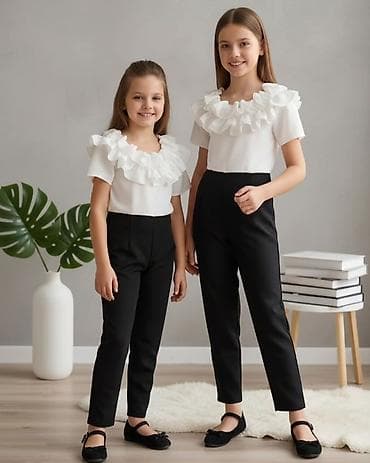 Dečija elegantna kombinacija – bela bluzica sa volanima i crne na lalafo.rs Dečija elegantna kombinacija – bela bluzica sa volanima i crne