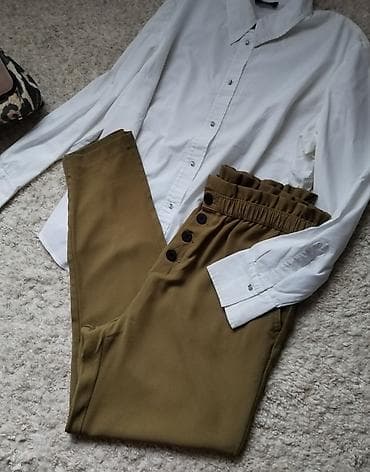 zenske original guess: Pantalone u pastelnoj zelenoj boji visokog struka sa dugmicima na lalafo.rs — 1 zenske original guess: Pantalone u pastelnoj zelenoj boji visokog struka sa dugmicima — 1