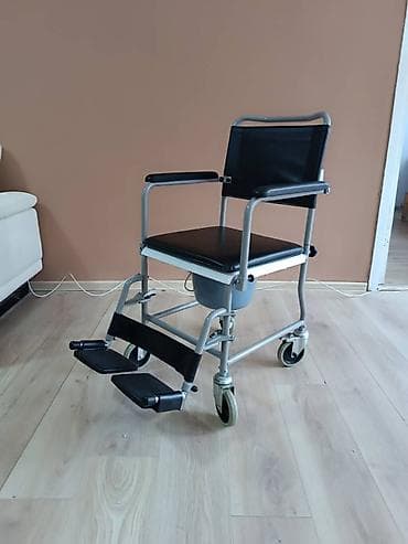 Toaletna stolica na točkićima (transportna/komod kolica) - Stabilan na lalafo.rs Toaletna stolica na točkićima (transportna/komod kolica) - Stabilan