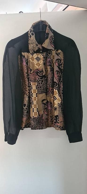 Košulja sa providnim rulavima i deo ledja, veličina 40 at lalafo.rs Košulja sa providnim rulavima i deo ledja, veličina 40