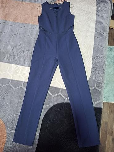 Elegantni ženski kombinezon bez rukava u tamnoplavoj boji. Ravan kroj na lalafo.rs — 2 Elegantni ženski kombinezon bez rukava u tamnoplavoj boji. Ravan kroj — 2