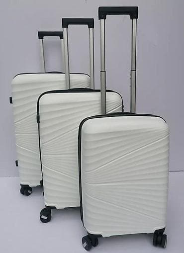 Travel suitcases and bags: === PART 1: TEXTUAL DESCRIPTION === Set od tri bela kofera sa tvrdim at lalafo.rs — 2 Travel suitcases and bags: === PART 1: TEXTUAL DESCRIPTION === Set od tri bela kofera sa tvrdim — 2