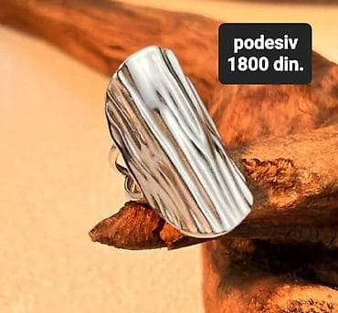 Masivni prsten od sjajno poliranog metala sa reljefnom, talasastom na lalafo.rs Masivni prsten od sjajno poliranog metala sa reljefnom, talasastom