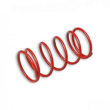 Crvena spiralna opruga, karakterističnog cilindričnog oblika sa na lalafo.rs Crvena spiralna opruga, karakterističnog cilindričnog oblika sa