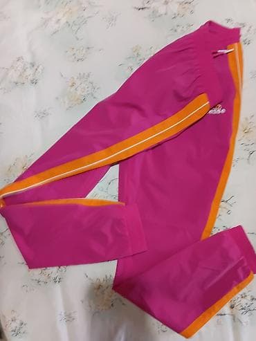Ellesse ženske trenerke – model sa bočnim prugama - Boja: intenzivno na lalafo.rs — 5 Ellesse ženske trenerke – model sa bočnim prugama - Boja: intenzivno — 5
