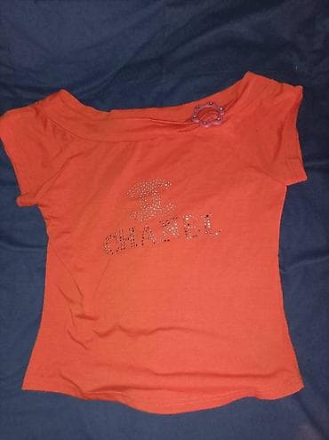 Na prodaju prelepa pamučna narandžasta Chanel majica sa brošem, S/M na lalafo.rs Na prodaju prelepa pamučna narandžasta Chanel majica sa brošem, S/M