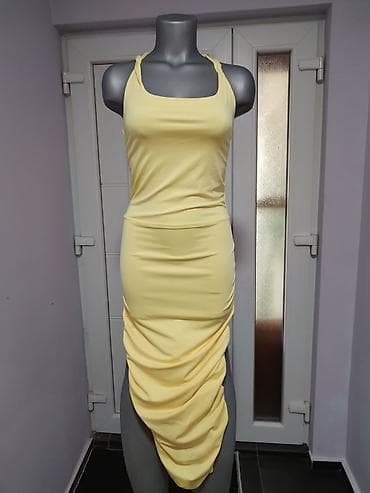 Ženska haljina bez rukava u nežno žutoj boji. XS/S veličina. Model sa na lalafo.rs Ženska haljina bez rukava u nežno žutoj boji. XS/S veličina. Model sa