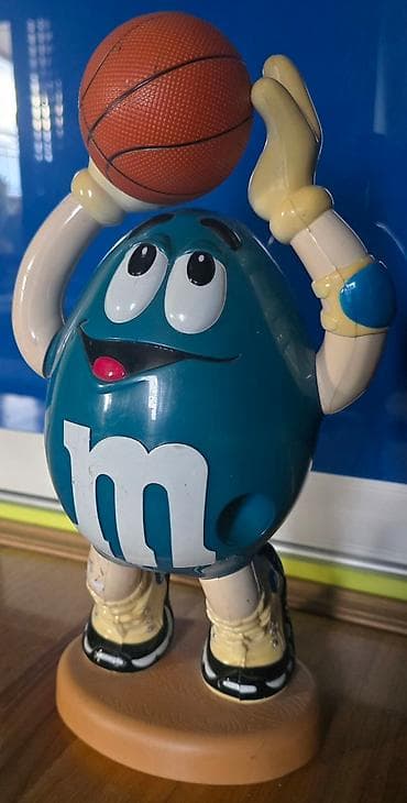 MM - M&M bonbone se ubace, i kad se povuce ruka ispadaju. Igracka na lalafo.rs — 1 MM - M&M bonbone se ubace, i kad se povuce ruka ispadaju. Igracka — 1