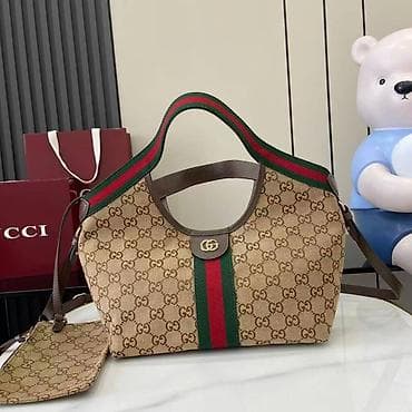 Gucci torba – GG Supreme platno sa prugom - Model: tote/shoulder na lalafo.rs — 1 Gucci torba – GG Supreme platno sa prugom - Model: tote/shoulder — 1