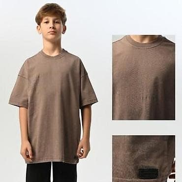 Dečija uniseks majica kratkih rukava u oversized kroju. Boja: toplije na lalafo.rs Dečija uniseks majica kratkih rukava u oversized kroju. Boja: toplije