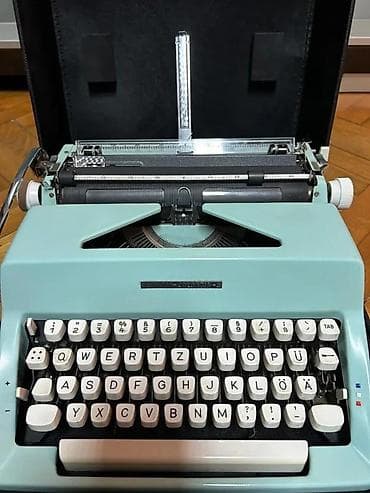 Olympia Colortip S – prenosna mehanička pisaća mašina - Boja kućišta na lalafo.rs Olympia Colortip S – prenosna mehanička pisaća mašina - Boja kućišta