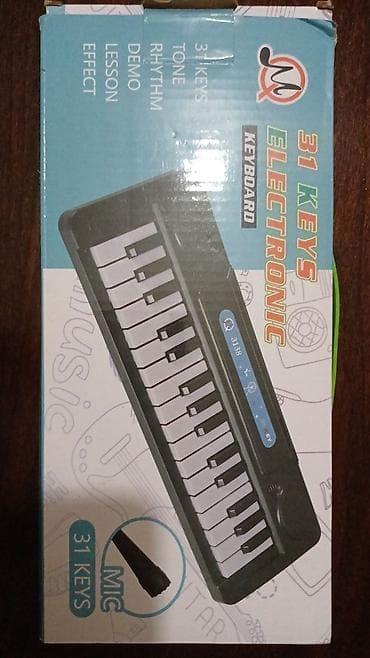 Ostale igračke: Elektronski klavijatur “31 Keys Keyboard” - 31 dirka – kompaktan na lalafo.rs — 1 Ostale igračke: Elektronski klavijatur “31 Keys Keyboard” - 31 dirka – kompaktan — 1