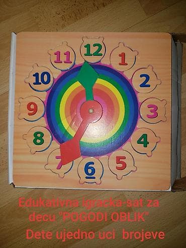 Deciji edukativi drveni sat 2 u 1. Dete igra igru "pogodi oblik" na lalafo.rs Deciji edukativi drveni sat 2 u 1. Dete igra igru "pogodi oblik"