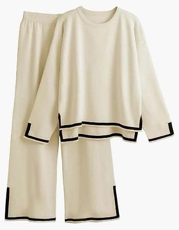 Komplet tunika sa rasecenim rukavim i sire pantalone sa slicevima. Bež na lalafo.rs Komplet tunika sa rasecenim rukavim i sire pantalone sa slicevima. Bež