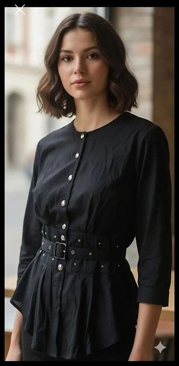 Elegantna ženska bluza/tunika u crnoj boji sa strukiranim siluetom na lalafo.rs Elegantna ženska bluza/tunika u crnoj boji sa strukiranim siluetom