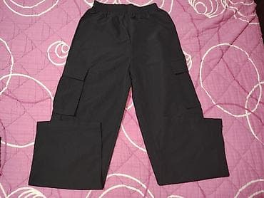 Crne cargo pantalone sa širokim krojem. Elastičan pojas sa lastišem za na lalafo.rs — 1 Crne cargo pantalone sa širokim krojem. Elastičan pojas sa lastišem za — 1