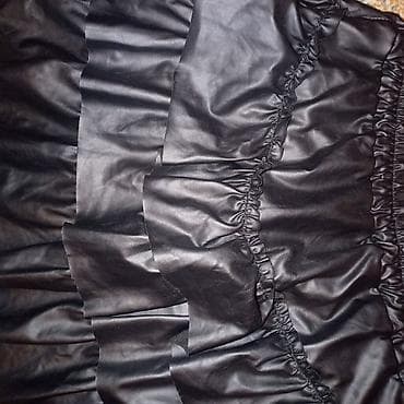 Crna mini suknja od eko kože sa volanima - Materijal: eko koža sa na lalafo.rs Crna mini suknja od eko kože sa volanima - Materijal: eko koža sa