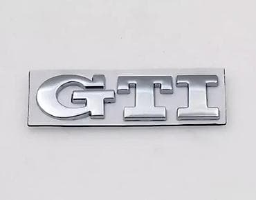 Hromirana oznaka „GTI” za automobil - Materijal: metalna/plastična na lalafo.rs Hromirana oznaka „GTI” za automobil - Materijal: metalna/plastična