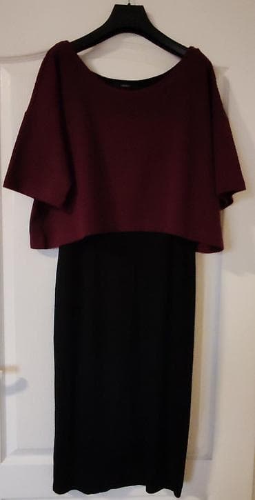 Elegantna dvobojna haljina midi dužine. Gornji deo u kroju pončo/bluza na lalafo.rs Elegantna dvobojna haljina midi dužine. Gornji deo u kroju pončo/bluza