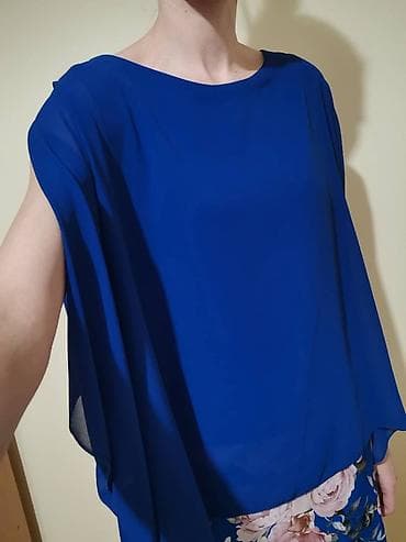 Plava haljina sa cvetnim dezenom. Kao nova, prelepih boja. Donji deo na lalafo.rs Plava haljina sa cvetnim dezenom. Kao nova, prelepih boja. Donji deo