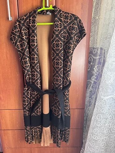 Ženski kardigan kratkih rukava sa bež i crnim dezenom. Ovaj kardigan na lalafo.rs Ženski kardigan kratkih rukava sa bež i crnim dezenom. Ovaj kardigan